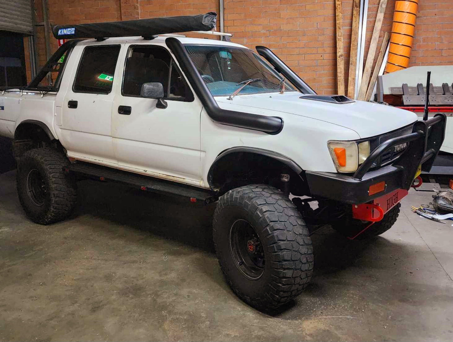 white pickup truck parked on a garage