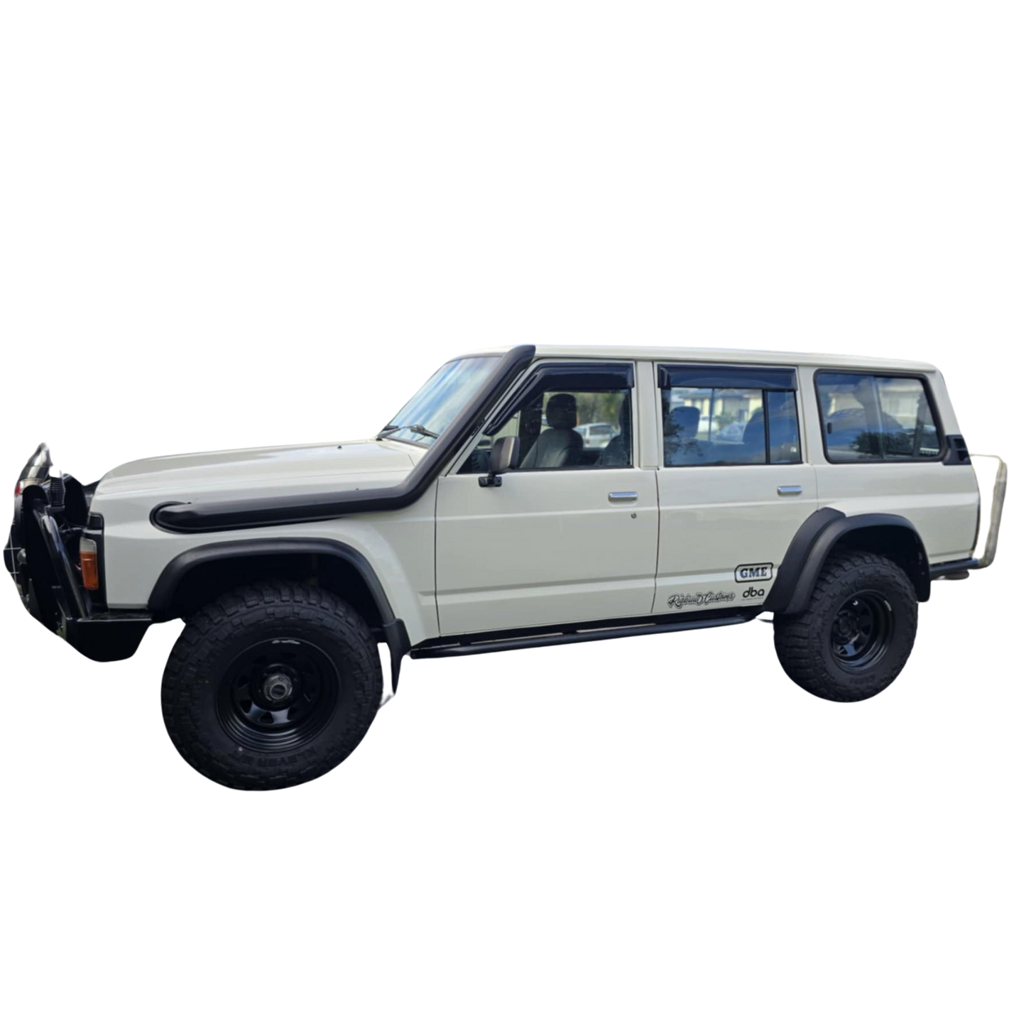 Show thumbnail preview
A vintage, white SUV with off-road tires and black trim.
